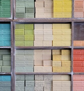 a shelf filled with lots of different colored bricks