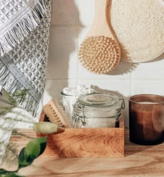 brown wooden chopping board beside clear glass jar